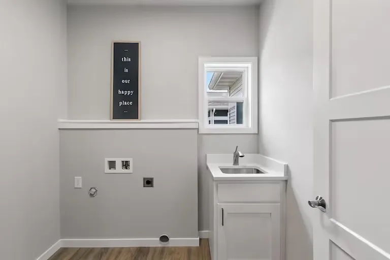 Laundry room view of a representative Wild Oak ranch home