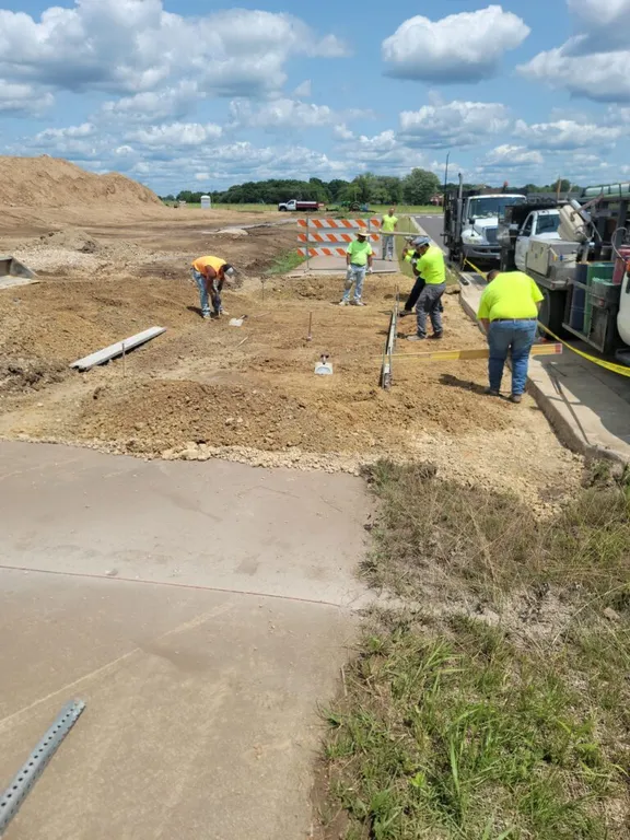 Forms prepared for pouring concrete driveway aprons